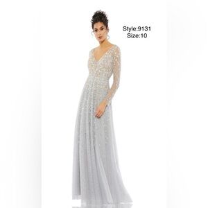Embellished wrap over illusion long sleeve gown
